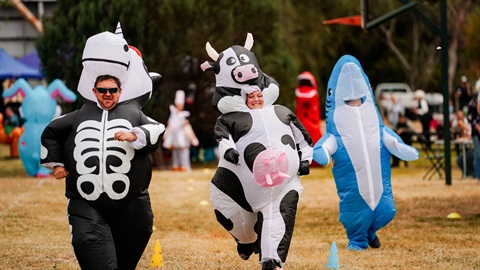 People in silly outfits racing